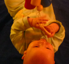 Infant transferring toy between hands
